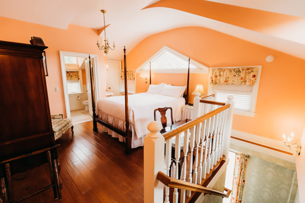 Lofted bedroom with an attached bathroom.