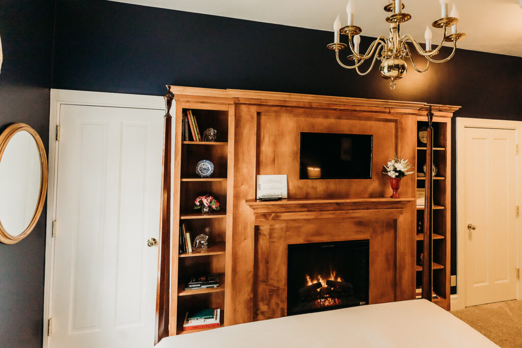 Photo of fireplace mantel with TV above.