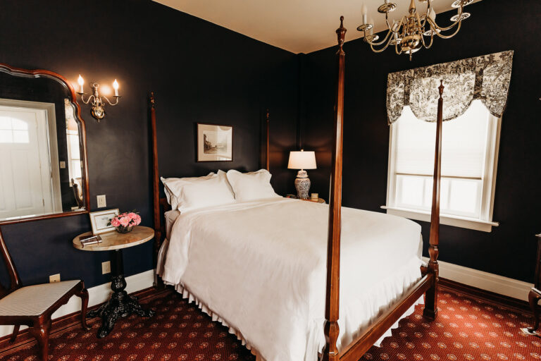 A photo of the comfortable bed offered in one of the guest rooms of The Rochester Inn.