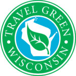 Travel Green Wisconsin Logo. It features an outline of Wisconsin with a leaf in the middle, and the words "Travel Green Wisconsin" circling the image with a green background.